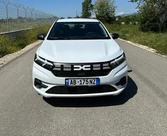 Front view of a rental Dacia Sandero at Tirana airport, Albania ✓ Car #10075. ✓ Manual TM ✓ 1 reviews.