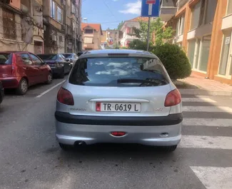 Ενοικίαση Peugeot 206. Αυτοκίνητο Οικονομική, Άνεση προς ενοικίαση στην Αλβανία ✓ Κατάθεση 100 EUR ✓ Επιλογές ασφάλισης: TPL, CDW, FDW, Στο εξωτερικό.