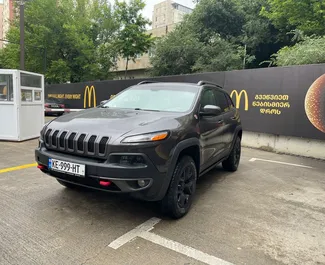 Front view of a rental Jeep Cherokee in Tbilisi, Georgia ✓ Car #10162. ✓ Automatic TM ✓ 0 reviews.