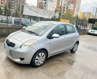 Front view of a rental Toyota Yaris at Tirana airport, Albania ✓ Car #10050. ✓ Manual TM ✓ 1 reviews.