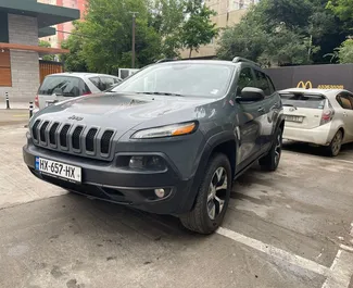 Front view of a rental Jeep Cherokee in Tbilisi, Georgia ✓ Car #10171. ✓ Automatic TM ✓ 0 reviews.