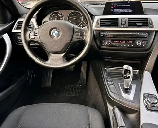 Diesel 2.0L engine of BMW 320d 2014 for rental at Tirana airport.