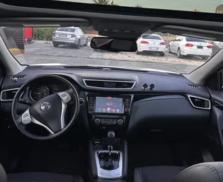 Interior of Nissan Qashqai for hire in Albania. A Great 5-seater car with a Automatic transmission.