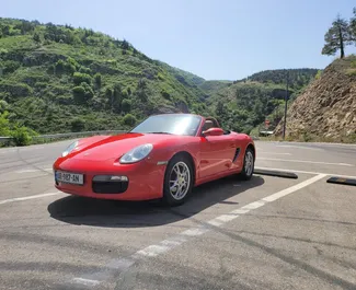 Vista frontal de um aluguel Porsche Boxster em Tbilisi, Geórgia ✓ Carro #10526. ✓ Transmissão Automático TM ✓ 0 avaliações.