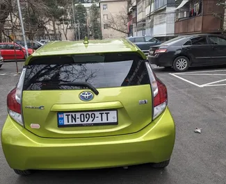 Toyota Prius C 2015 available for rent in Tbilisi, with unlimited mileage limit.