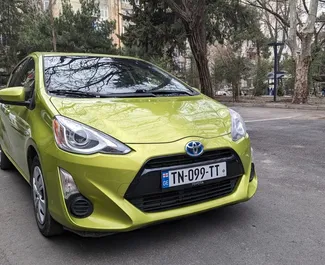 Front view of a rental Toyota Prius C in Tbilisi, Georgia ✓ Car #10669. ✓ Automatic TM ✓ 0 reviews.