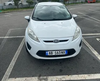 Front view of a rental Ford Fiesta in Tirana, Albania ✓ Car #10600. ✓ Automatic TM ✓ 0 reviews.