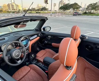 Mini Cooper S Cabrio 2024 tillgänglig för uthyrning i Dubai, med en körsträckegräns på 250 km/dag.