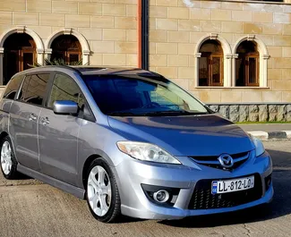 Frontvisning av en leiebil Mazda 5 i Kutaisi, Georgia ✓ Bil #8675. ✓ Automatisk TM ✓ 1 anmeldelser.