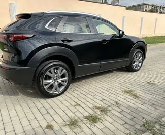 Mazda CX-30 kiralama. Ekonomi, Konfor, Crossover Türünde Araç Kiralama Gürcistan'da ✓ Depozitosuz ✓ TPL, FDW, Yolcular, Hırsızlık sigorta seçenekleri.