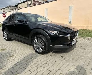 Araç Kiralama Mazda CX-30 #10904 Otomatik Tiflis'te, 2,5L motor ile donatılmış ➤ Nanuka tarafından Gürcistan'da.