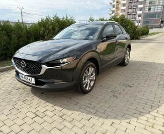 Kiralık bir Mazda CX-30 Tiflis'te, Gürcistan ön görünümü ✓ Araç #10904. ✓ Otomatik TM ✓ 0 yorumlar.