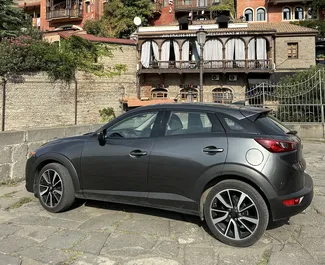 Mazda CX-3 2018 auto rentimine Gruusias, sisaldab ✓ Bensiin kütust ja 150 hobujõudu ➤ Alates 120 GEL päevas.