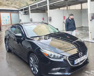 Mazda 3 2019 araç kiralama Gürcistan'da, ✓ Benzin yakıt ve 150 beygir gücü özellikleriyle ➤ Günde başlayan fiyatlarla 70 GEL.