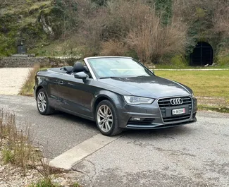 Sprednji pogled najetega avtomobila Audi A3 Cabrio v v mestu Becici, Črna gora ✓ Avtomobil #11958. ✓ Menjalnik Samodejno TM ✓ Mnenja 0.