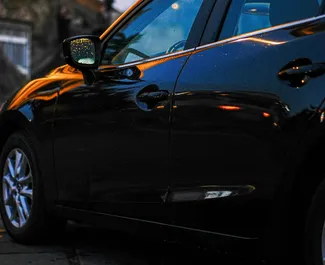 Aluguel de Mazda 3. Carro Económico, Conforto para Alugar na Geórgia ✓ Depósito de 200 GEL ✓ Opções de seguro: TPL, CDW, SCDW, Roubo.