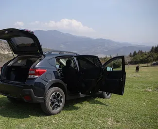 Interiøret til Subaru Crosstrek til leie i Georgia. En flott 5-seters bil med Automatisk-gir.
