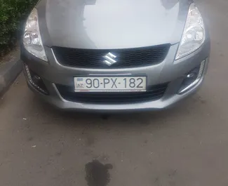 Frontvisning av en leiebil Suzuki Swift i Baku, Aserbajdsjan ✓ Bil #13498. ✓ Automatisk TM ✓ 0 anmeldelser.