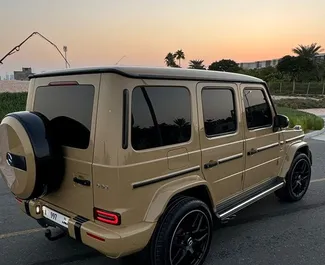 Арендуйте Mercedes-Benz G63 2019 в ОАЭ. Топливо: Бензин. Мощность: 577 л.с. ➤ Стоимость от 1450 AED в сутки.