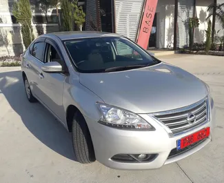 Frontvisning av en leiebil Nissan Sylphy i Pafos, Kypros ✓ Bil #3166. ✓ Automatisk TM ✓ 0 anmeldelser.
