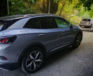 Volkswagen ID4 2023 auton vuokraus Georgiassa, sisältää ✓ Sähkö polttoaineen ja 465 hevosvoimaa ➤ Alkaen 235 GEL päivässä.