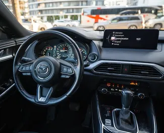 Mazda CX-9 2023 διαθέσιμο για ενοικίαση στο Μπατούμι, με όριο χιλιομέτρων 300 χλμ/ημέρα.