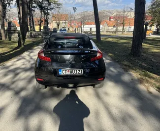 Renault Wind Cabrio bérlése. Kényelmes, Kabrió típusú autó bérlése Montenegróban ✓ Letét nélkül ✓ Biztosítási opciók: TPL, Külföldön, Nincs befizetés.