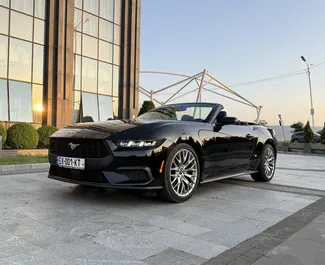 Ενοικίαση αυτοκινήτου Ford Mustang Cabrio 2025 στη Γεωργία, περιλαμβάνει ✓ καύσιμο Βενζίνη και 320 ίππους ➤ Από 330 GEL ανά ημέρα.