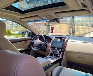 Pronájem Mazda CX-9. Auto typu Komfort, Prémiová, Crossover k pronájmu v Ázerbájdžánu ✓ Vklad 200 AZN ✓ Možnosti pojištění: TPL, CDW, Krádež.