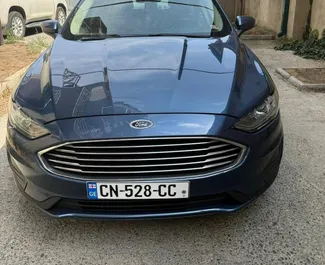 Ford Fusion Sedan vuokraus. Mukavuus, Premium auto vuokrattavana Georgiassa ✓ Ilman talletusta ✓ Vakuutusvaihtoehdot: TPL, FDW, Varkaus, Ei talletusta.