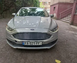 Přední pohled na pronájem Ford Fusion Sedan v Tbilisi, Georgia ✓ Auto č. 14832. ✓ Převodovka Automatické TM ✓ Recenze 0.