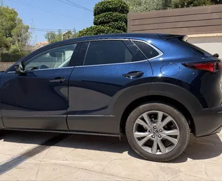 Mazda CX-30 location. Économique, Confort, Crossover Voiture à louer en Espagne ✓ Dépôt de 500 EUR ✓ RC options d'assurance.