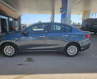 واجهة أمامية لسيارة إيجار Fiat Egea في في مطار دالامان, تركيا ✓ رقم السيارة 15280. ✓ ناقل حركة يدوي ✓ تقييمات 0.