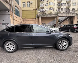 Framvy av en hyrbil Tesla Model-X i Tbilisi, Georgien ✓ Bil #15272. ✓ Växellåda Automatisk TM ✓ 0 recensioner.