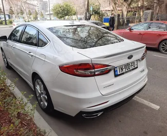 Ford Fusion Sedan 2019 automobilio nuoma Gruzijoje, savybės ✓ Hibridinis degalai ir 188 arklio galios ➤ Nuo 140 GEL per dieną.
