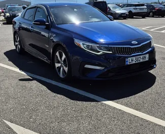 Frontvisning av en leiebil Kia Optima i Kutaisi, Georgia ✓ Bil #14105. ✓ Automatisk TM ✓ 0 anmeldelser.