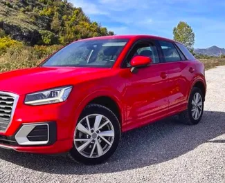 Front view of a rental Audi Q2 at Podgorica Airport, Montenegro ✓ Car #15662. ✓ Automatic TM ✓ 0 reviews.