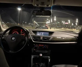 BMW X1 2013 available for rent in Tirana, with unlimited mileage limit.