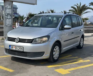 Front view of a rental Volkswagen Touran in Bar, Montenegro ✓ Car #15727. ✓ Automatic TM ✓ 0 reviews.