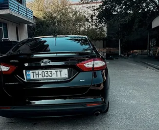 Ford Fusion Sedan – автомобиль категории Комфорт, Премиум напрокат в Грузии ✓ Депозит 200 GEL ✓ Страхование: ОСАГО, КАСКО, Супер КАСКО, Пассажиры, От угона, Без депозита.