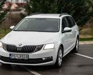 Priekinė automobilio, kurį nuomojate Skoda Octavia Combi Podgoricoje, Juodkalnija vaizdas ✓ Automobilis #9027. ✓ Pavarų dėžė Automatinis TM ✓ Atsiliepimai 0.