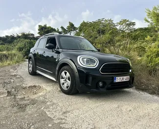 Front view of a rental Mini Countryman Cooper at Podgorica Airport, Montenegro ✓ Car #15690. ✓ Automatic TM ✓ 0 reviews.