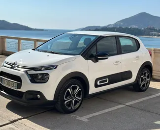 Front view of a rental Citroen C3 in Rafailovici, Montenegro ✓ Car #16077. ✓ Manual TM ✓ 0 reviews.
