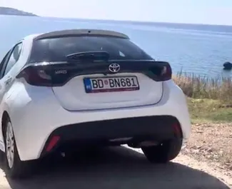 Front view of a rental Toyota Yaris at Podgorica Airport, Montenegro ✓ Car #16209. ✓ Automatic TM ✓ 0 reviews.
