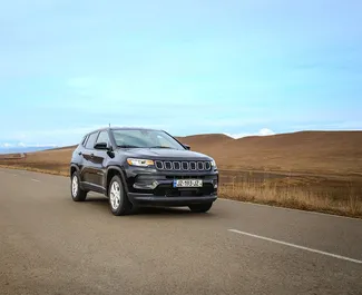 Front view of a rental Jeep Compass in Tbilisi, Georgia ✓ Car #16286. ✓ Automatic TM ✓ 0 reviews.
