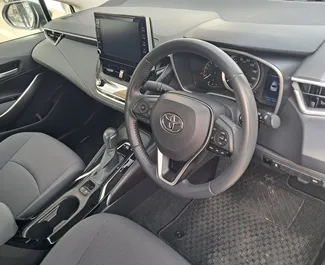 Interior of Toyota Corolla Sedan for hire in Cyprus. A Great 5-seater car with a Automatic transmission.