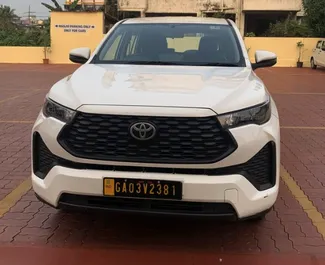 Front view of a rental Toyota Innova Hycross at Goa Airport, Goa ✓ Car #16164. ✓ Automatic TM ✓ 0 reviews.