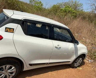 Front view of a rental Suzuki Swift at Goa Airport, Goa ✓ Car #16194. ✓ Manual TM ✓ 0 reviews.