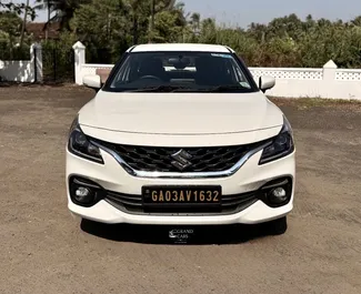 Front view of a rental Suzuki Baleno at Goa Airport, Goa ✓ Car #16160. ✓ Automatic TM ✓ 0 reviews.