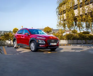 Pronájem Hyundai Kona. Auto typu Komfort, Crossover k pronájmu v Gruzii ✓ Vklad 270 GEL ✓ Možnosti pojištění: TPL, CDW, SCDW, FDW, Cestující, Krádež.